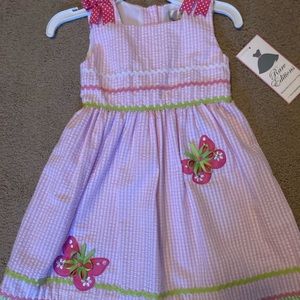 Beautiful spring/summer dress with butterflies and bow detail. Never worn
